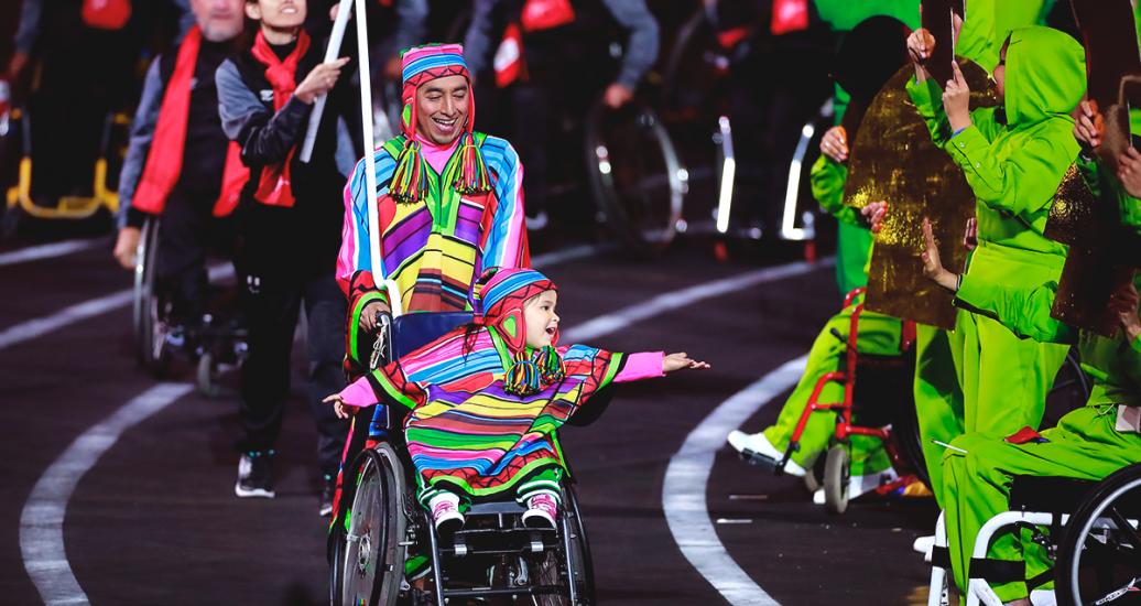 A man and a little girl in a wheelchair were the smiling placard bearers who escorted the Peruvian Para athletes delegation during the Lima 2019 Parapan American Games Opening Ceremony at the National Stadium.
